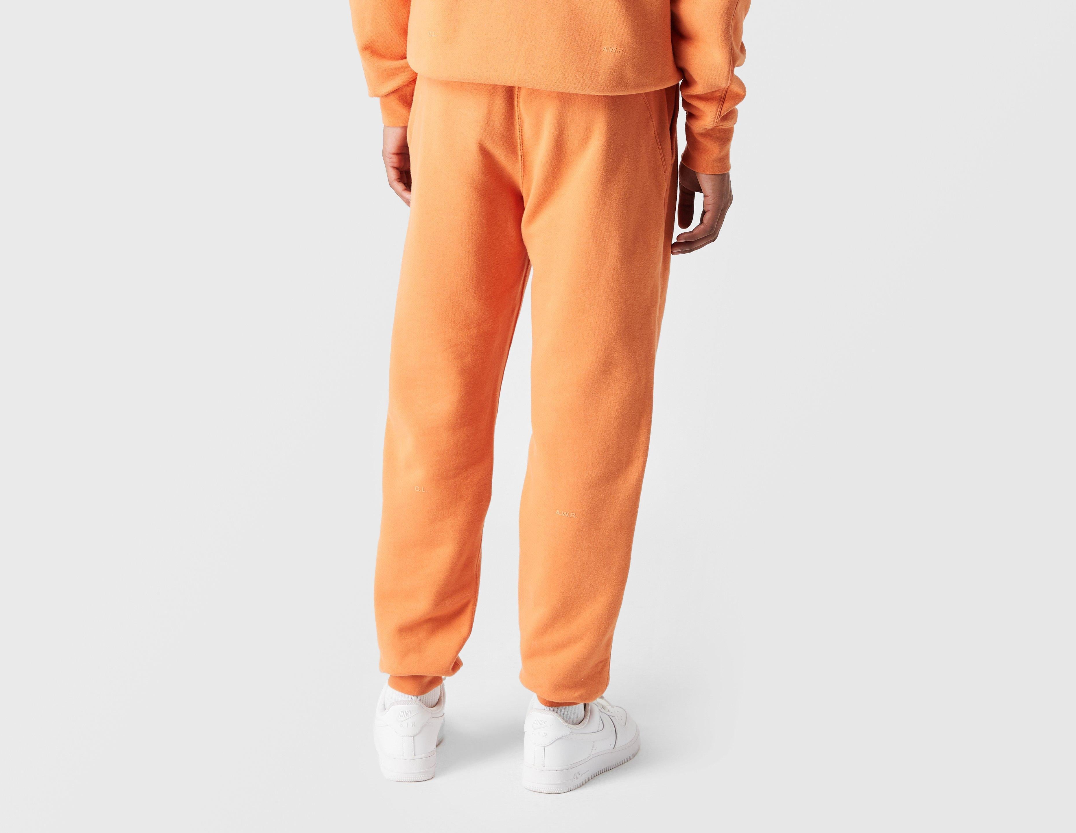 orange joggers nike