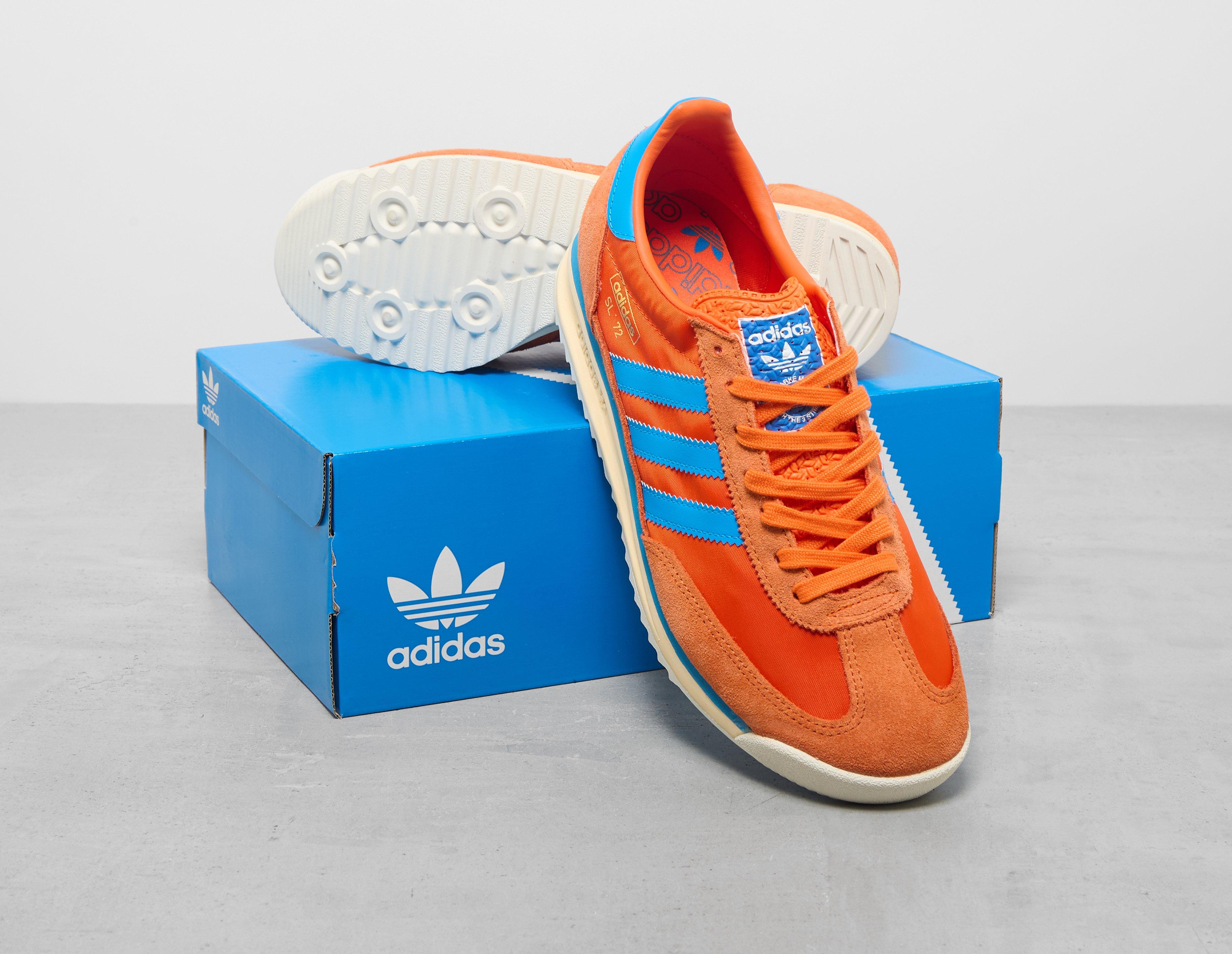 adidas shoes with orange stripes
