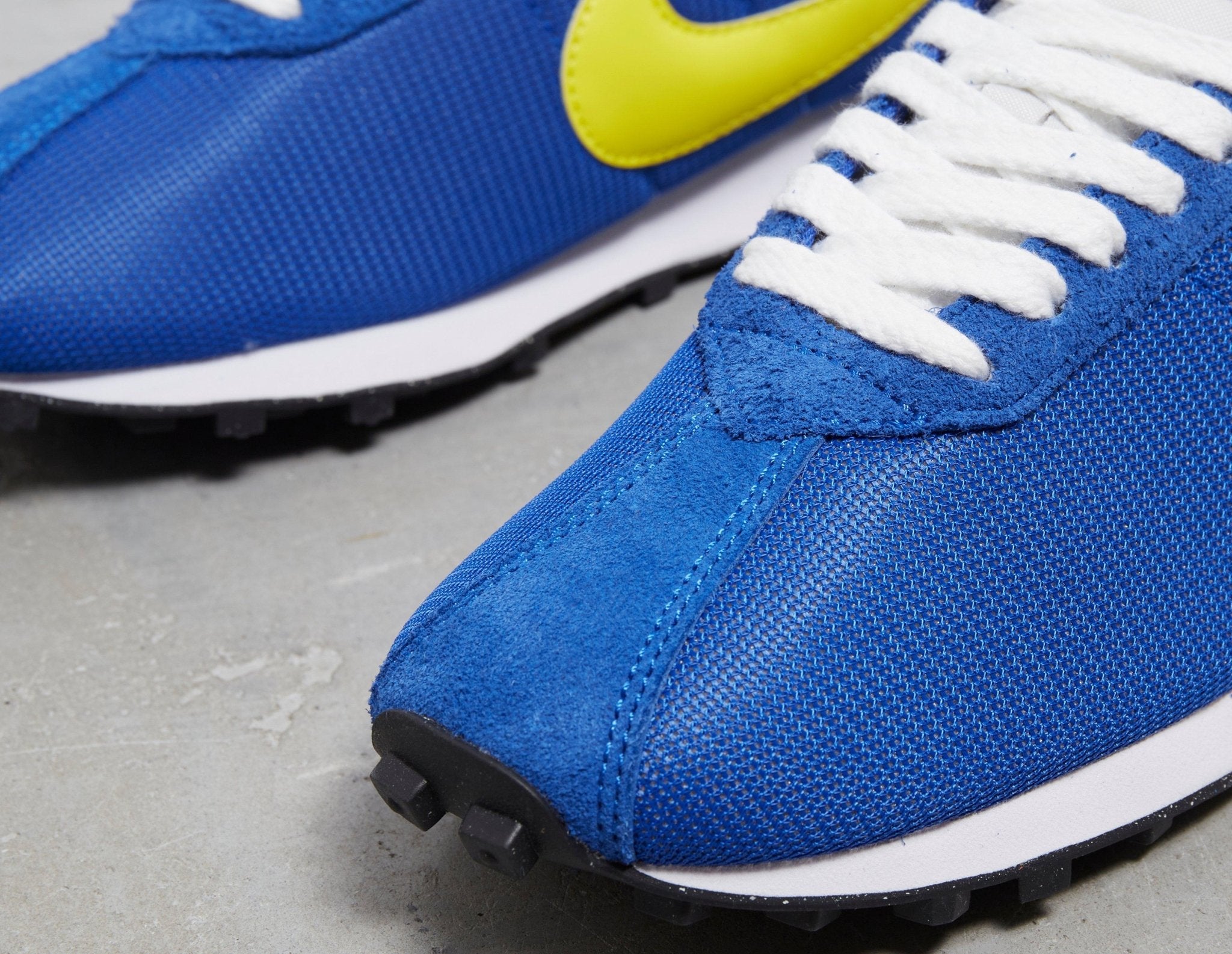 blue nike yellow swoosh